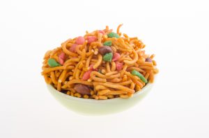 Bowl of traditional crispy Asian snack on a white background Bowl of traditional crispy Asian snack on a white background