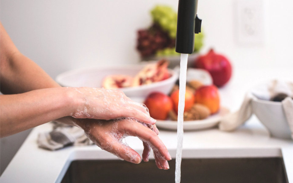 Handwashing at a black sink