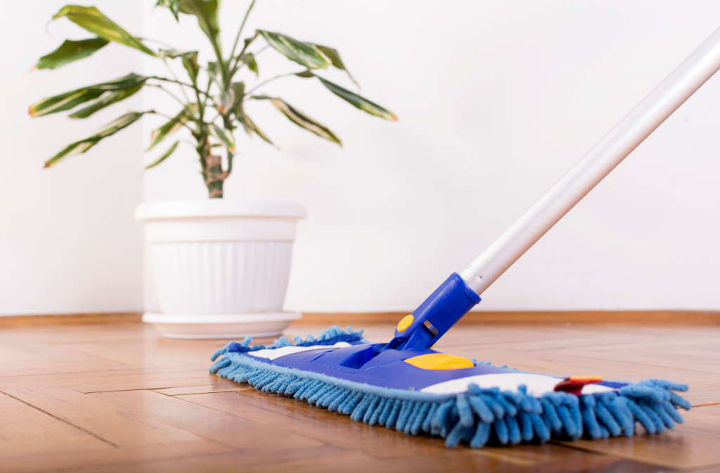 Wooden vinyl flooring with a blue microfibre mop