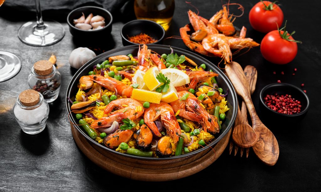 Traditional Spanish Seafood Paella on a black background