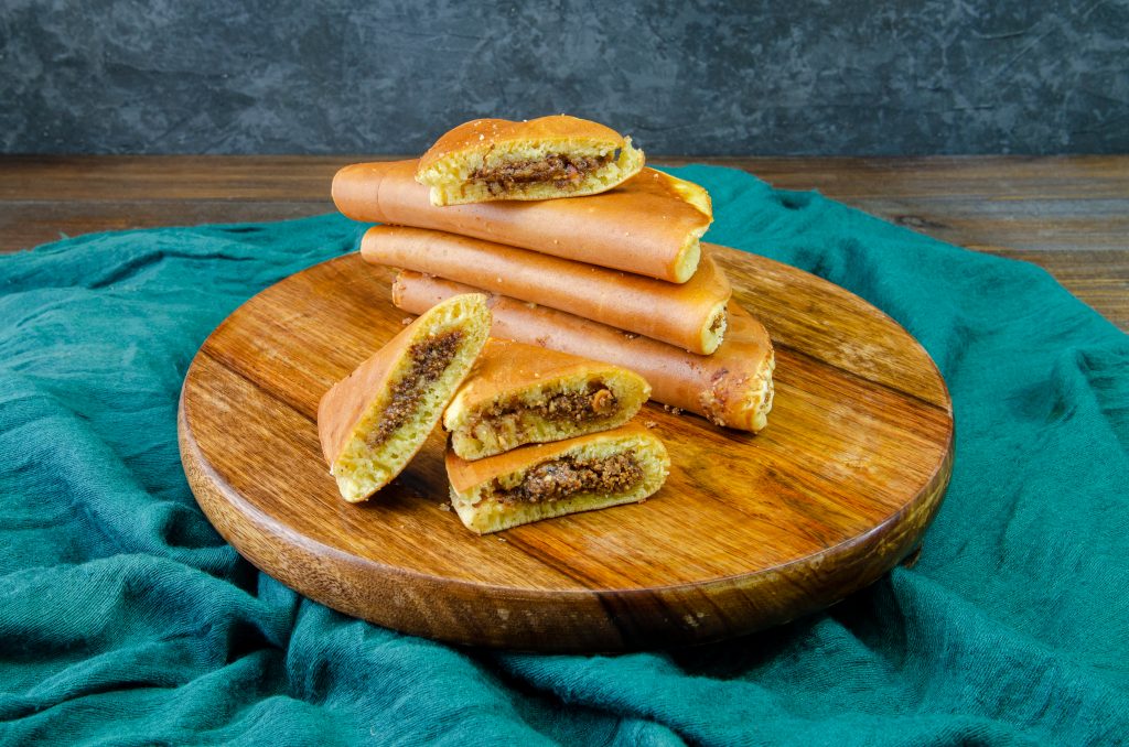 Apam Balik on a wooden round plate