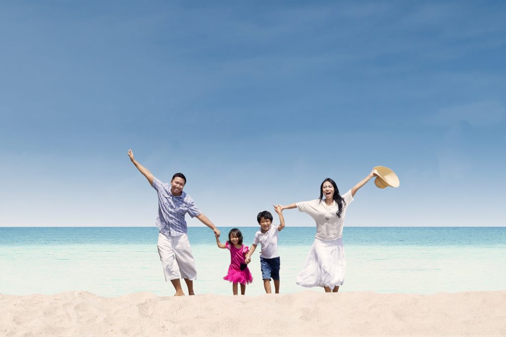 Happy,Asian,Family,Running,At,Beach