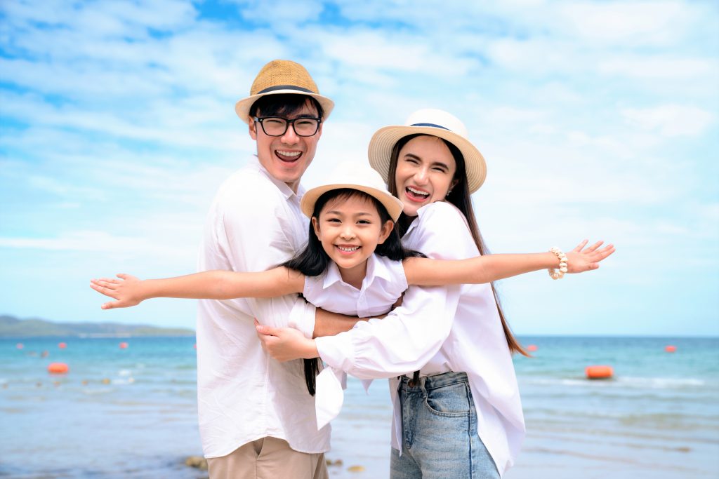 Happy,Family,On,The,Beach.,People,Having,Fun,On,Summer