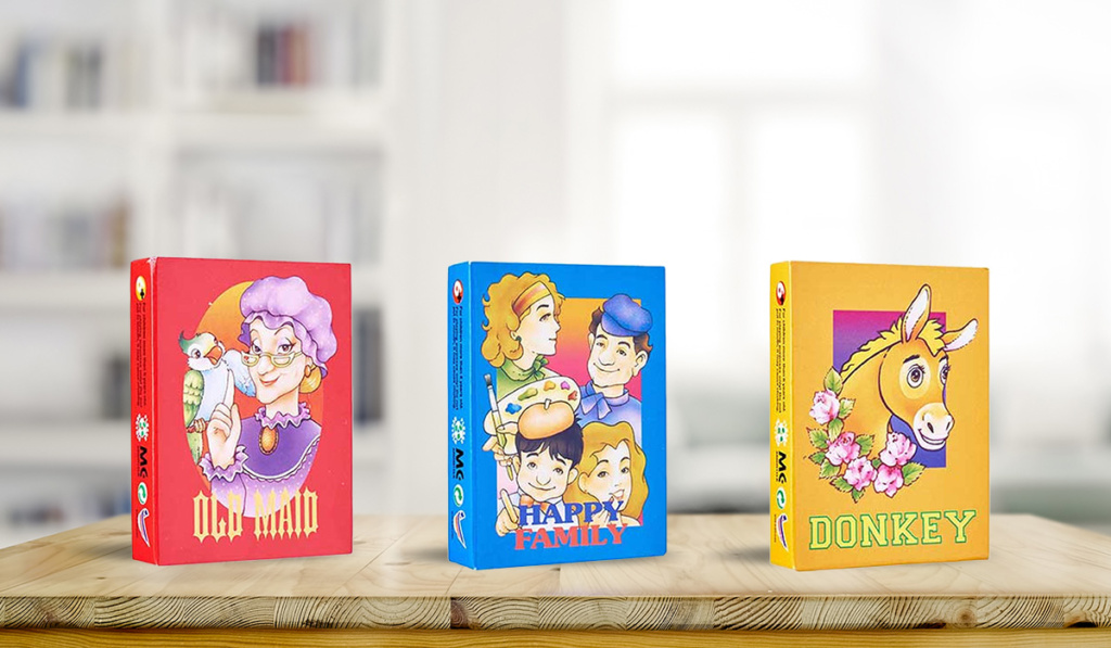 Card-Games 3 packs of card games on a wooden table