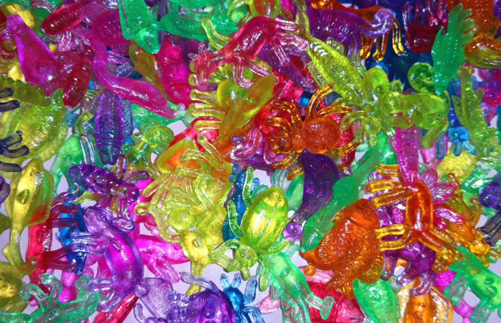 Kuti Kuti Close-up of brightly coloured, tiny plastic figurines in the shape of animals